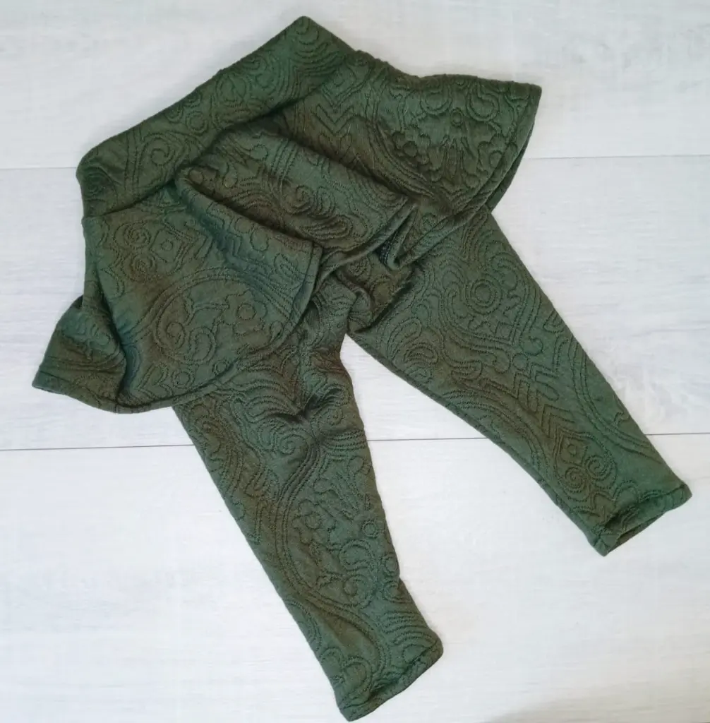 Embossed green skirt pants.webp