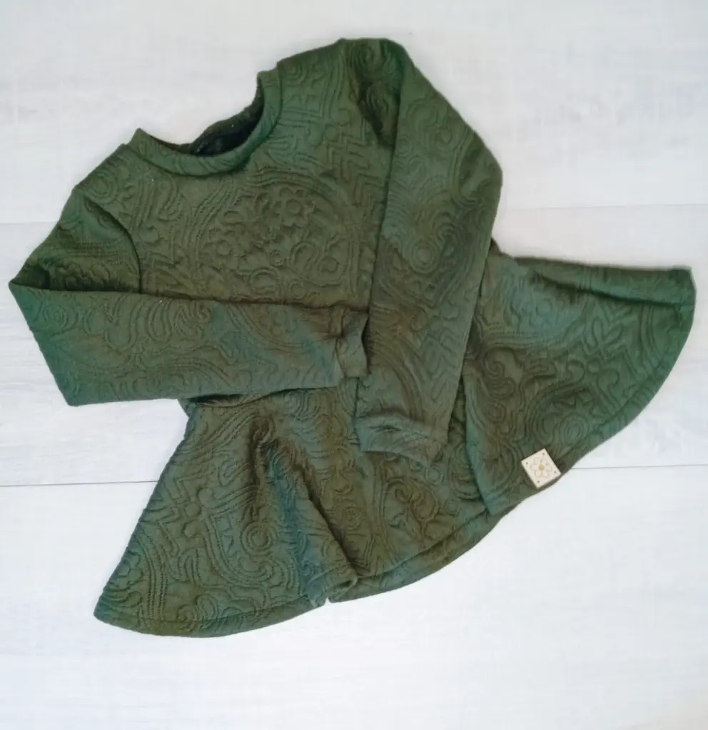 Embossed green peplum top.webp